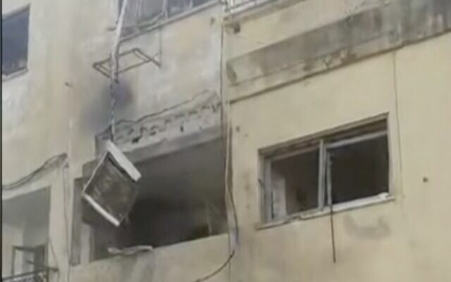 A building in Shtula stuck with an anti-tank missile from Lebanon on January 8, 2024. (Screen capture/Channel 12)