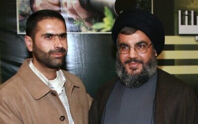 Senior Hezbollah commander Wissam al-Tawil (L) with the terror group's chief Hassan Nasrallah in an undated photo. (Courtesy)