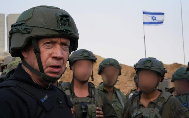 Defense Minister Yoav Gallant is seen with IDF troops in the central Gaza Strip, January 2, 2024. (Ariel Hermoni/Defense Ministry)
