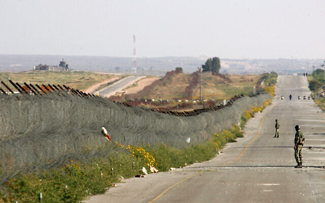 Illustrative: Egyptian soldiers patrol on a road parallel to the Philadelphi Corridor, a buffer zone that separates Egypt from Israel and the Palestinian Gaza Strip, March 19, 2007. ( Cris Bouroncle/AFP)