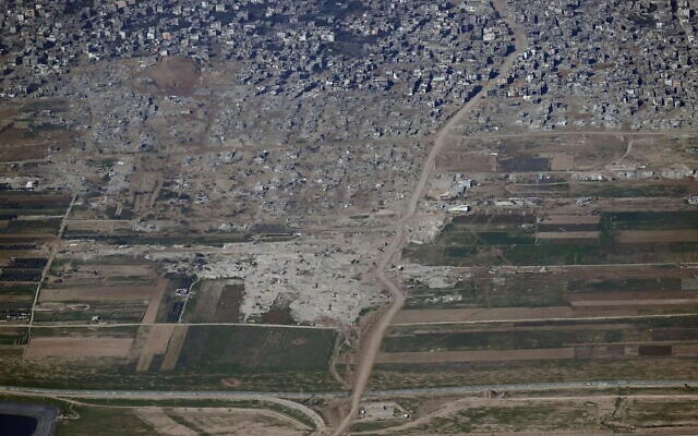 Buildings razed in Gaza City's Shejaiya neighborhood, as part of the army's efforts to establish a buffer zone on the border with the Gaza Strip, in an image provided by the IDF on January 10, 2024. The Israel-Gaza border runs across the bottom of the picture. (Israel Defense Forces)