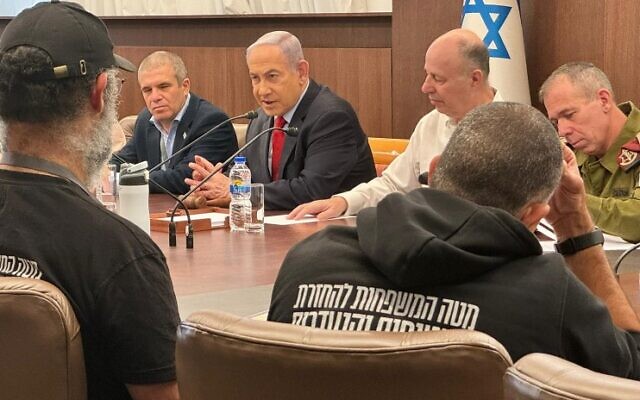 Prime Minister Benjamin Netanyahu in a meeting with relatives of hostages held in Gaza, at the Prime Minister's Office in Jerusalem on January 22, 2024. (Prime Minister's Office)