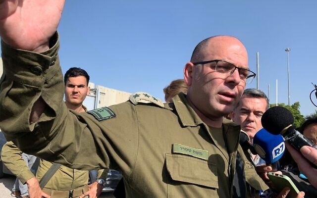 Col. Moshe Tetro speaks during a briefing at the Kerem Shalom border crossing with Gaza on January 10, 2024. (Charlie Summers/Times of Israel)