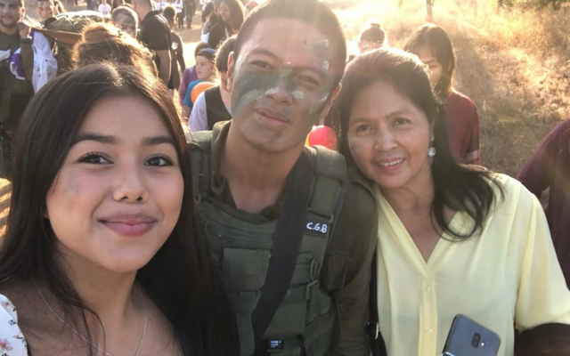 Sgt. First Class (res.) Cedrick Garin with his mother Imelda (right) and wife Daniela (left) in 2021. (IDF)