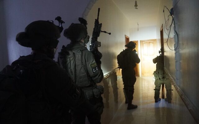 IDF troops from the 98th Division raiding Hamas offices in Khan Younis in this handout photo released on January 29, 2024. (Israel Defense Forces)