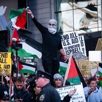 Pro-Palestinian, anti-Israel demonstrators at a rally in Times Square, October 13, 2023. (Luke Tress / JTA)
