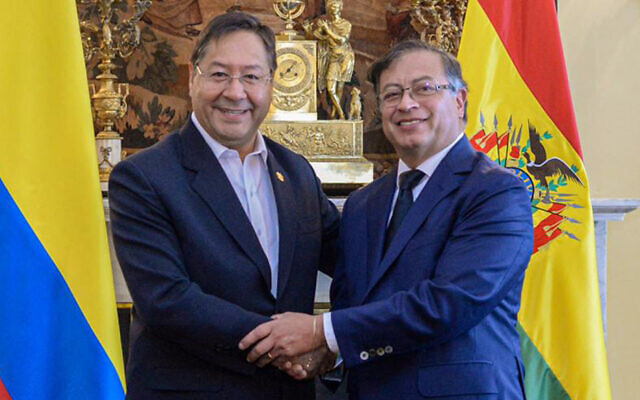 Handout picture released by the press office of Colombia's then president-elect Gustavo Petro (R) shows him meeting with Bolivia's President Luis Arce (L) before his inauguration ceremony in Bogota, on August 7, 2022. (Gustavo Petro's Press Office/AFP)