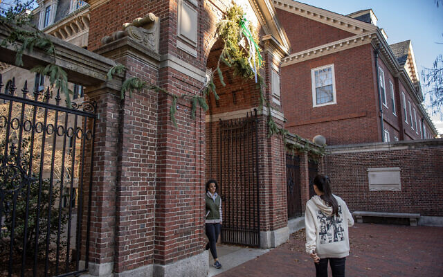 File: People enter and exit Harvard Yard at a gate at Harvard University in Cambridge, Massachusetts on December 12, 2023. (Joseph Prezioso/AFP)