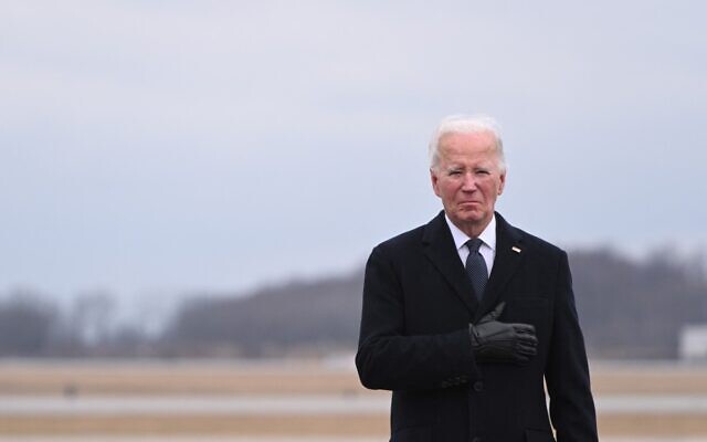 US President Joe Biden attends the dignified transfer of the remains of three US service members killed in the drone attack on the US military outpost in Jordan, at Dover Air Force Base in Dover, Delaware, on February 2, 2024. (Roberto Schmidt/AFP)