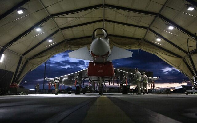A handout picture released by the British Ministry of Defence on February 3, 2024 shows RAF Typhoon FRG4s being prepared to conduct strikes against targets in Yemen. (Cpl Samantha Drummee / MOD / AFP)