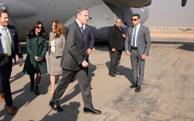 US Secretary of State Antony Blinken is welcomed by the Second Secretary for Egypt's  Ministry of Foreign Affairs protocol Sarah Henry second from left, and US Ambassador to Egypt Herro Mustafa Garg, third from left, upon arrival at Cairo East Airport in Cairo on February 6, 2024. (Mark Schiefelbein / POOL / AFP)
