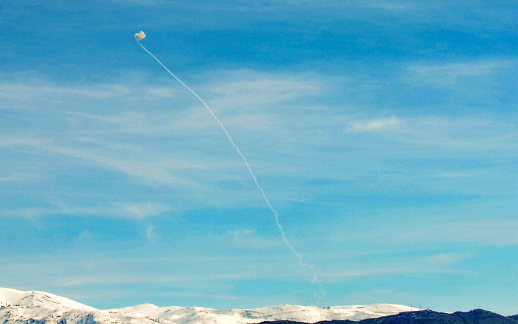 This picture taken from the vicinity of Marjayoun in southern Lebanon on February 8, 2024, shows a rocket fired from above nearby Kafarshouba being intercepted by Israel's Iron Dome. (Rabih Daher/AFP)