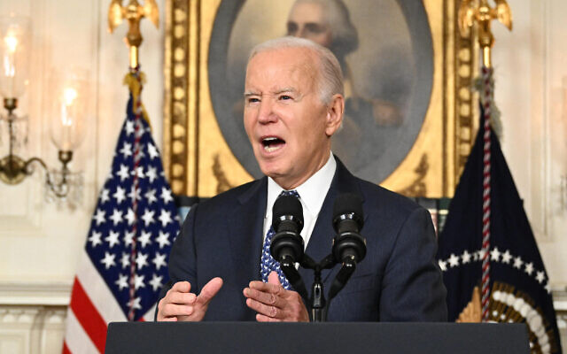 US President Joe Biden answers questions about Israel after speaking about the Special Counsel report at the White House in Washington, on February 8, 2024. (Mandel Ngan/AFP)