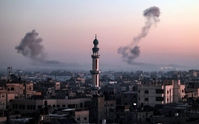 A picture taken from Rafah shows smoke billowing during Israeli strikes over Khan Younis in the southern Gaza Strip at sunrise on February 11, 2024, amid the ongoing conflict between Israel and Hamas. (SAID KHATIB/AFP)
