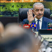 Palestinian Authority Prime Minister Mohammad Shtayyeh chairs a cabinet meeting in Ramallah on February 20, 2024. (Jaafar ASHTIYEH / AFP)
