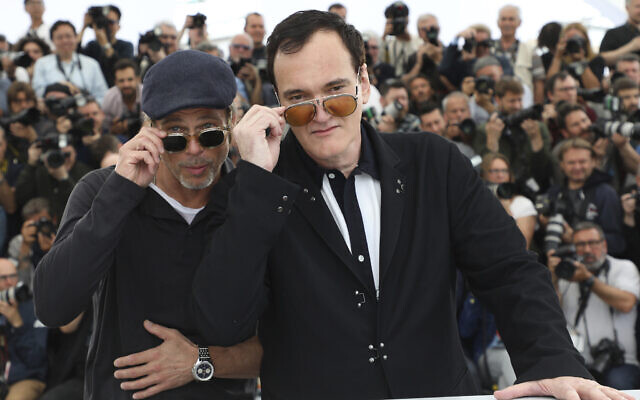 Actor Brad Pitt, left, and director Quentin Tarantino pose for photographers at the photo call for the film 'Once Upon a Time in Hollywood' at the 72nd international film festival, Cannes, southern France, Wednesday, May 22, 2019. (Vianney Le Caer/Invision/AP)