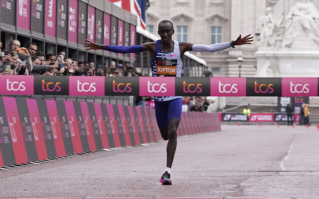 File: Kenya's Kelvin Kiptum crosses the finish line to win the men's race at the London Marathon in London, Sunday, April 23, 2023 (AP Photo/Alberto Pezzali)