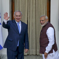 File: India's Prime Minister Narendra Modi, right, gestures and Israeli Prime Minister Benjamin Netanyahu waves to the media as they arrive for a meeting in New Delhi, India, Jan.15, 2018. (AP Photo, File)