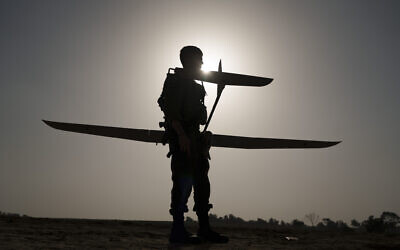 Illustrative: An Israeli soldier prepares a drone to be launched near the Israeli-Gaza border, southern Israel, January 9, 2024. (AP Photo/Leo Correa)