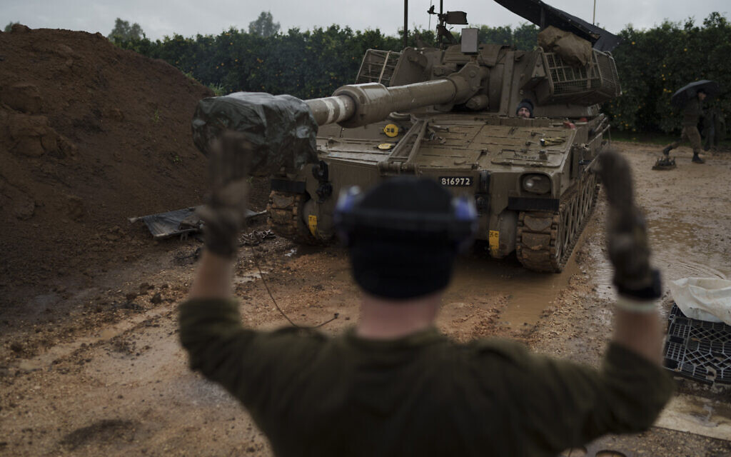 An Israeli mobile howitzer gets into position near the border with Lebanon in northern Israel, January 11, 2024. (Leo Correa/AP)