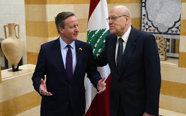 Britain's Foreign Secretary David Cameron, left, speaks with Lebanese caretaker Prime Minister Najib Mikati in Beirut, Lebanon, Thursday, Feb. 1, 2024. (AP Photo/Bilal Hussein)