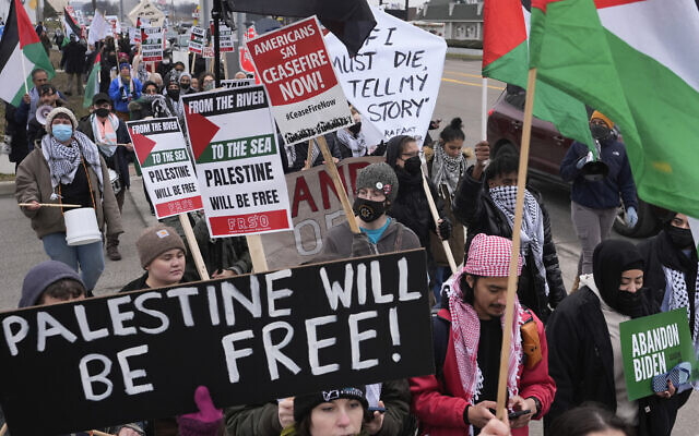 Pro-Palestinian demonstrators march during a visit by US President Joe Biden in Warren, Michigan, February 1, 2024. (AP Photo/Paul Sancya)