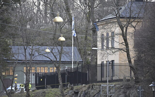 Officers stand near the Israeli Embassy in Stockholm, Sweden, Jan. 31, 2024. (Henrik Montgomery/TT News Agency via AP)
