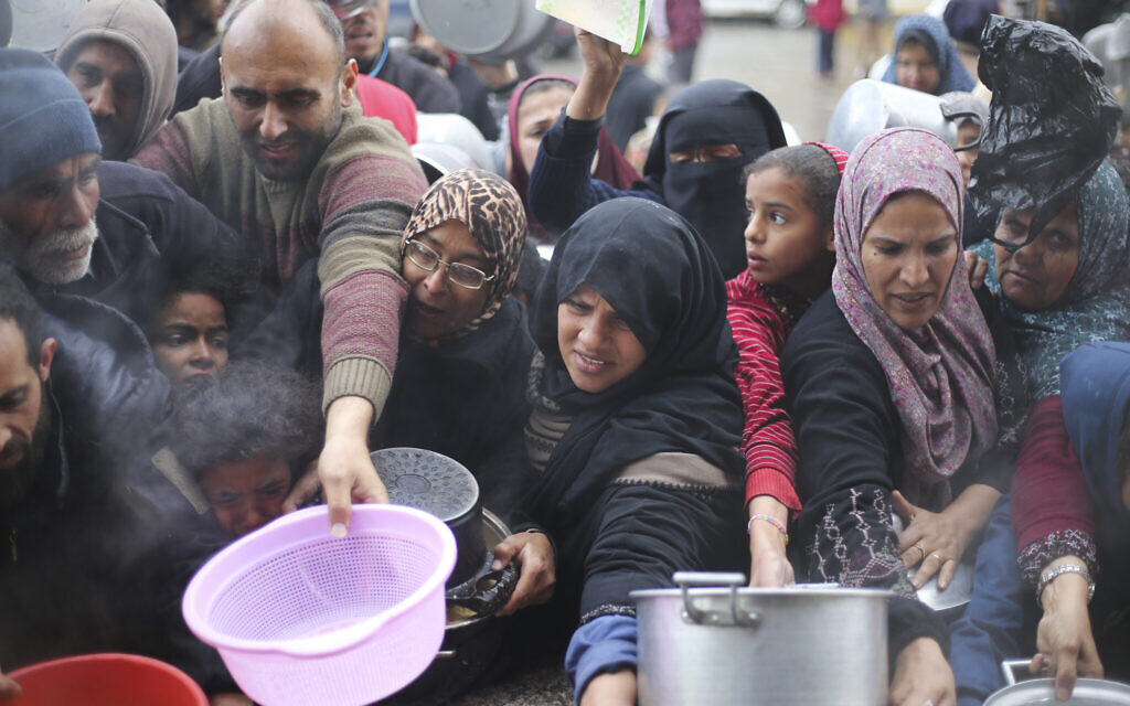 Palestinians line up for free food distribution in Khan Younis, Gaza Strip, Feb. 2, 2024. (AP Photo/Hatem Ali)