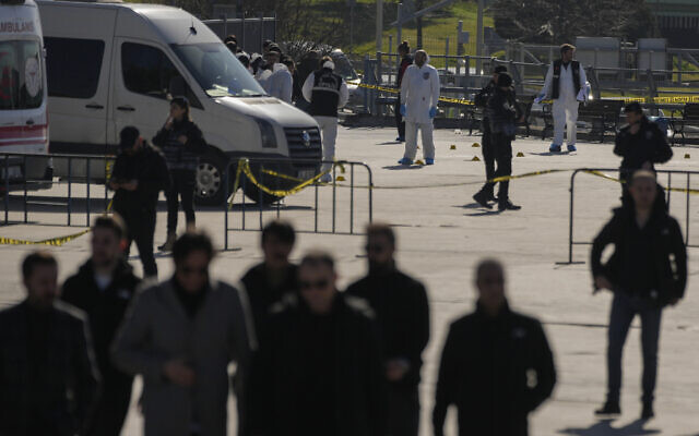 Security officers check the site where two attackers were killed outside a courthouse in Istanbul, Turkey, February 6, 2024. (AP Photo/Francisco Seco)