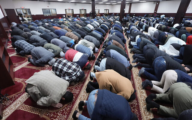 Men pray at the Islamic Center of Detroit in Detroit, January 26, 2024. (Paul Sancya/AP)