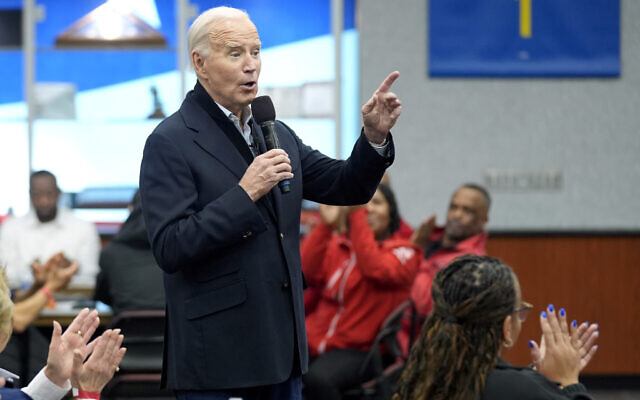 US President Joe Biden meets with UAW members during a campaign stop at a phone bank in the UAW Region 1 Union Hall, in Warren, Michigan, February 1, 2024. (Evan Vucci/AP)