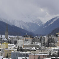 Snow covers the hills around Davos, Switzerland, on January 19, 2020. (AP Photo/ Markus Schreiber, File)