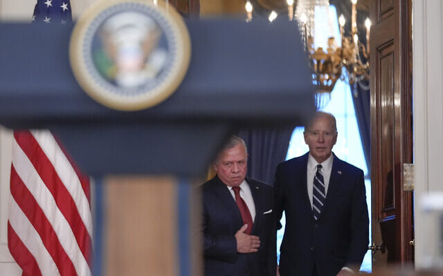 US President Joe Biden arrives with Jordan's King Abdullah II to speak in the Cross Hall of the White House, Monday, Feb. 12, 2024, in Washington. (AP Photo/Andrew Harnik)