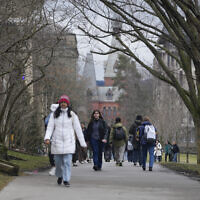 Illustrative: People walk on the campus of Cornell University in Ithaca, New York, February 2, 2024. (AP Photo/Seth Wenig)