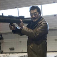 This image provided by the US Attorney, Southern District of New York shows a photo from a complaint document filed by SDNY of Takeshi Ebisawa handling a rocket launcher.  Federal prosecutors say the leader of a Japan-based crime syndicate conspired to traffic uranium and plutonium from Myanmar in the belief that Iran would use it for nuclear weapons. (US Attorney, Southern District of New York via AP)