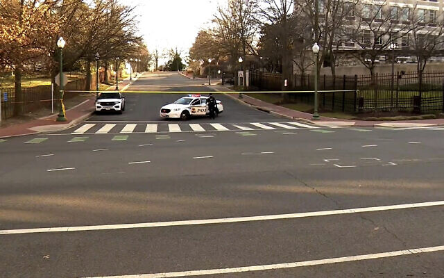 In this image taken from video, police are deployed outside the Israeli Embassy in Washington, Sunday, Feb. 25, 2024, after an active-duty member of the US Air Force was critically injured after setting himself ablaze outside the diplomatic compound. (WJLA via AP)
