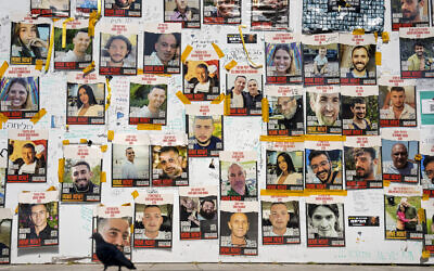 Pictures of hostages held by terror groups in Gaza since October 7, in Tel Aviv, February 26, 2024. (AP Photo/Ariel Schalit)
