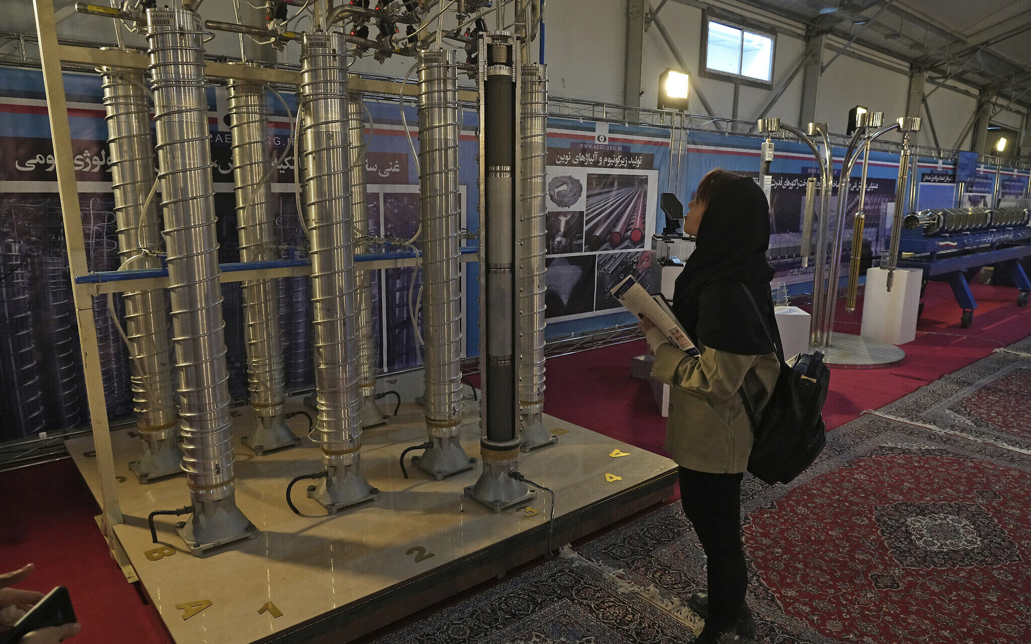 IAEA warns Iran building up uranium stockpile, still barring senior monitors
