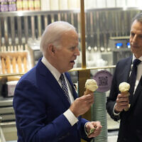 US President Joe Biden, left, eats ice cream with comedian Seth Meyers at Van Leeuwen Ice Cream Monday, Feb. 26, 2024, in New York. (AP/Evan Vucci)