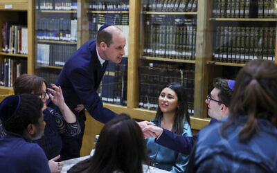 Britain's Prince William meets with young people together with Holocaust Educational Trust ambassadors, as he visits the Western Marble Arch Synagogue, London, Feb. 29, 2024. (Toby Melville/Pool photo via AP)