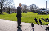US President Joe Biden waves to members of the media before boarding Marine One on the South Lawn of the White House in Washington DC, Feb. 29, 2024. (Andrew Harnik/AP)