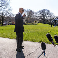 US President Joe Biden waves to members of the media before boarding Marine One on the South Lawn of the White House in Washington DC, Feb. 29, 2024. (Andrew Harnik/AP)