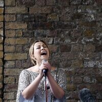 British singer Charlotte Church performs during a Greenpeace protest against drilling for oil in the Arctic, outside the Shell Centre, London, August. 26, 2015. (Frank Augstein/AP)