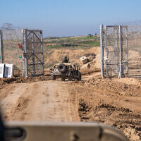 IDF Humvees enter the Gaza Strip near Kibbutz Be'eri, February 8, 2024. (Emanuel Fabian/Times of Israel)