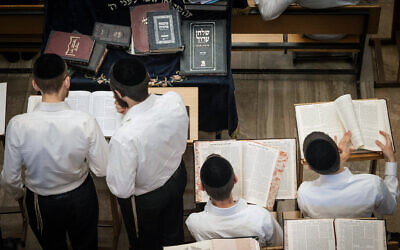 Ultra-Orthodox men study at the Kamenitz Yeshiva, in Jerusalem, on August 22, 2023. (Chaim Goldberg/Flash90)