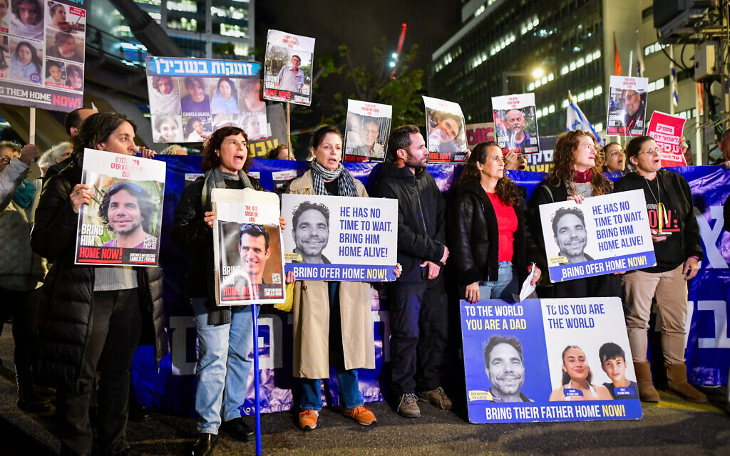 Families of Israelis held kidnapped by Hamas terrorists in Gaza protest outside the Defense Ministry headquarters in Tel Aviv, February 6, 2024. (Avshalom Sassoni/Flash90)