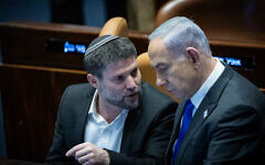 Prime Minister Benjamin Netanyahu, left, and Finance Minister Bezalel Smotrich attend a Knesset vote on the state budget, February 7, 2024. (Yonatan Sindel/Flash90)