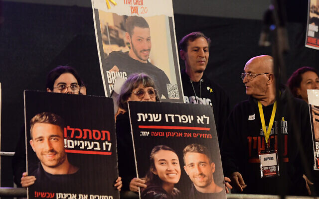 Protesters hold posters of hostages at a rally for the release of Israelis held kidnapped by Hamas terrorists in Gaza, at Hostages Square in Tel Aviv, February 10, 2024. (Avshalom Sassoni/ Flash90)