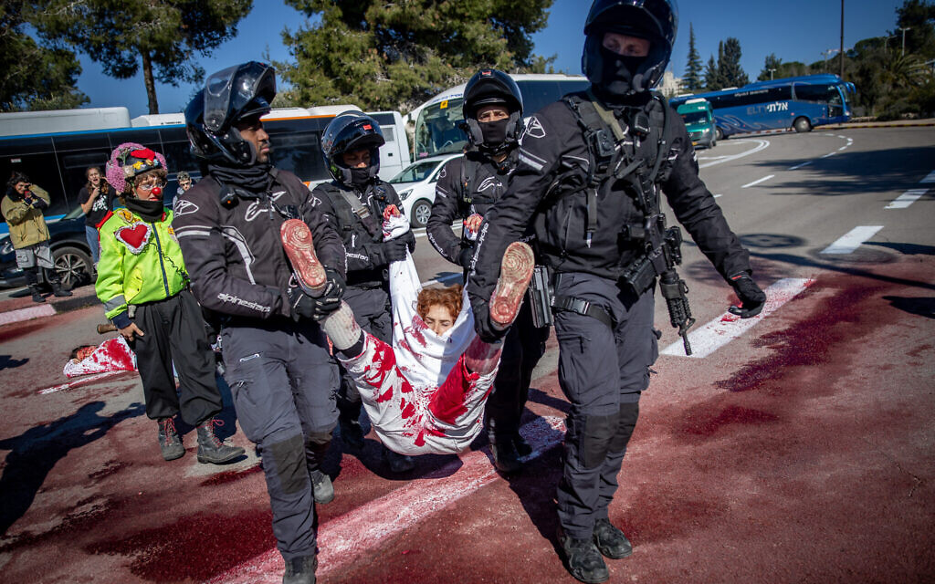 Police detain protesters calling for the release of Israelis held hostage by Hamas in Gaza, outside the Knesset in Jerusalem, February 11, 2024. (Oren Ben Hakoon/Flash90)