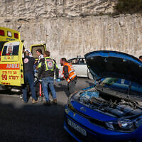 Police at the scene of a terror shooting attack on Route 1 near Ma'ale Adumim, in the West Bank, February 22, 2024. (Chaim Goldberg/Flash90)